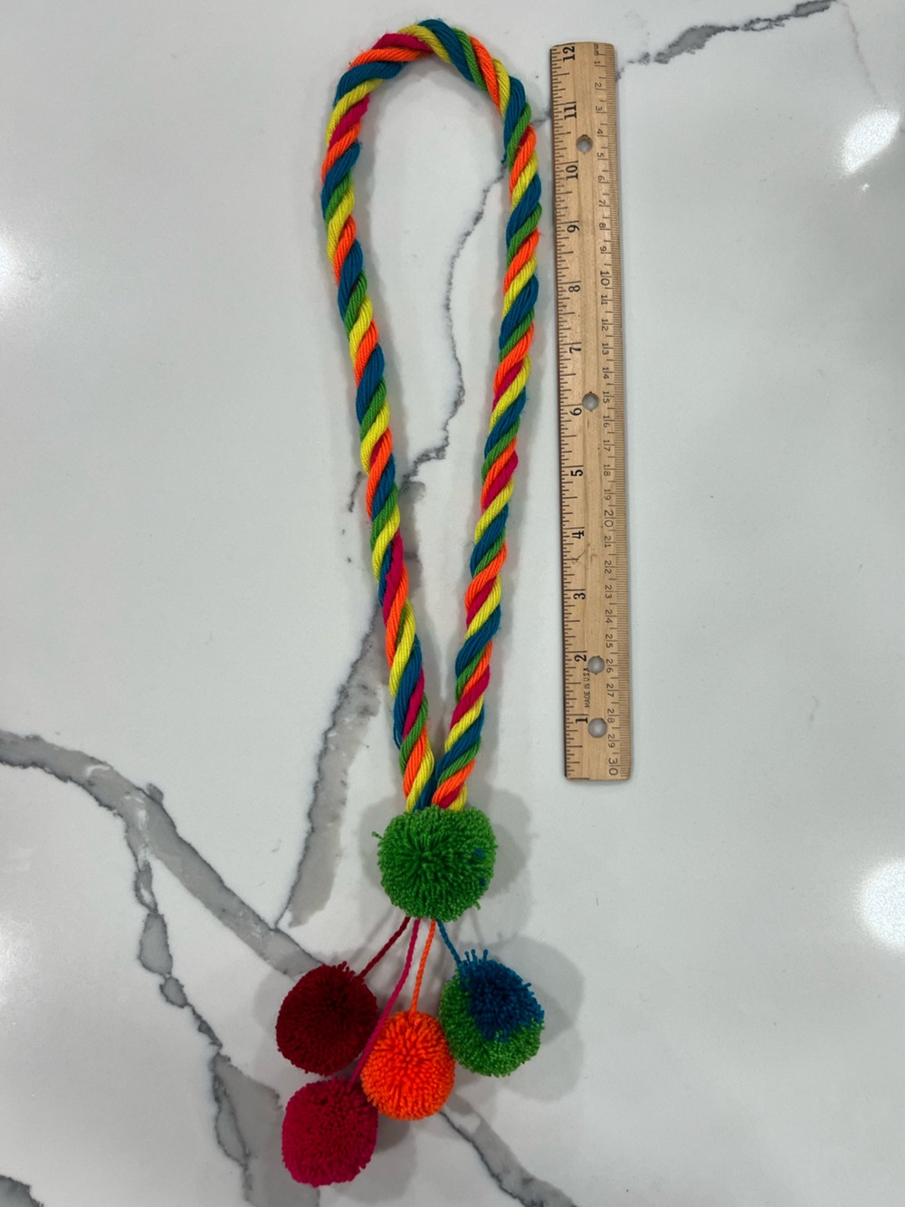 Used Multicolor Rope Necklace with Pom-Pom Ends. Made by Colombian-Wayuu artist.